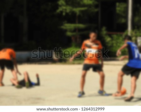 Blurred images of students playing football