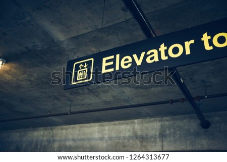 Elevator sign in parking garage (Horizontal Frame).