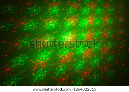 Background with green and red stars.Laser projector patterns.