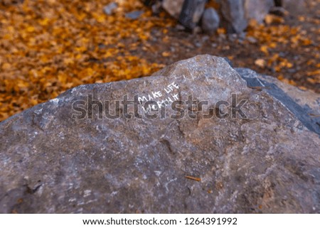 Make life worth it written on a rock seen on hike