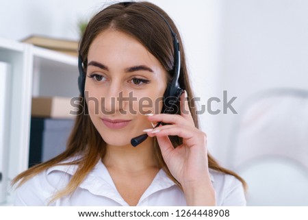 young pretty woman use headphones in office have serious business conversation