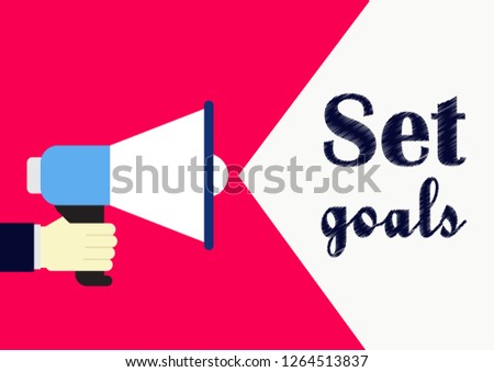 Set goals. Business concept phrase. Hand holding megaphone