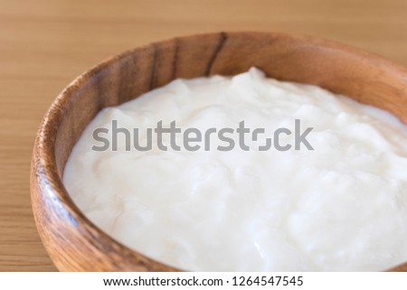 Yogurt in a wooden dish
