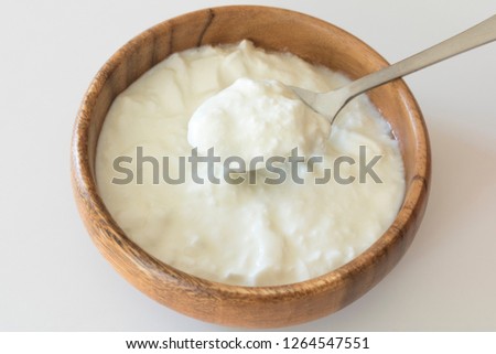 Yogurt in a wooden dish