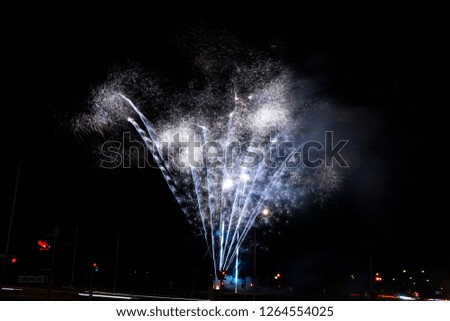 A fireworks display against the night sky 