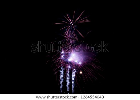 A fireworks display against the night sky 