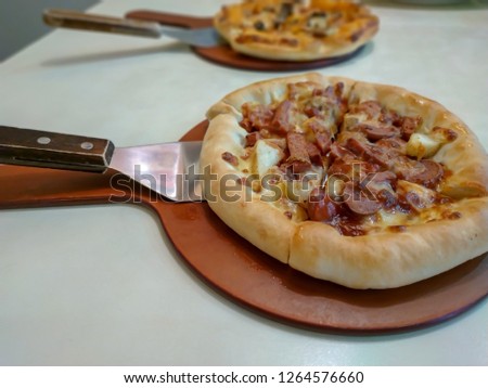 Italian food meat sausage pizza ready to serve