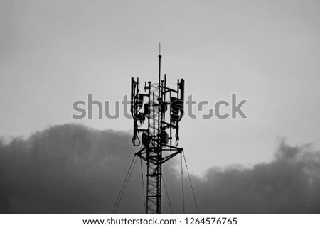 3G, 4G and 5G cellular. Base Station or Base Transceiver Station. Telecommunication tower. Wireless Communication Antenna Transmitter. Telecommunication tower with antennas and gray background.