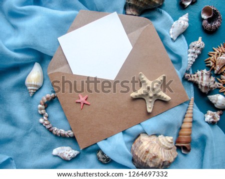 envelope, starfish and seashells on a blue background. congratulation. invitation