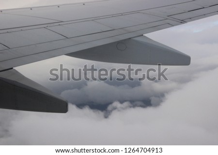airplane wing in the clouds