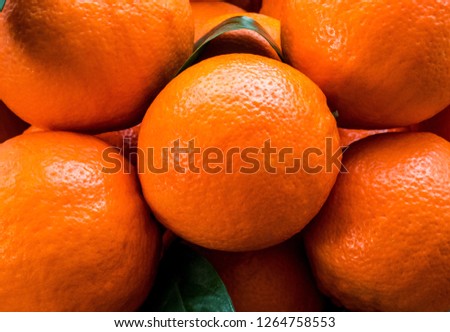 Full oranges  with leaves closeup picture