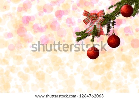 Fit tree with red glitter balls on white background. Bokeh effects. Christmas postcard.