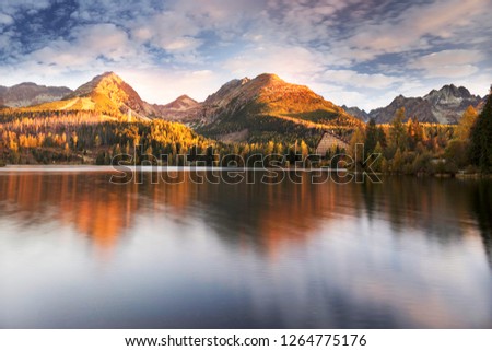 Strbske Pleso is the second largest lake on the Slovak side of the High Tatras. The ski resort, hotels under the mountain tops are very beautiful and famous/ On the shore are red boats