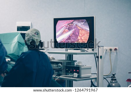 Bariatric weight loss surgery with a gastric band or through removal of a portion of the stomach or gastric bypass surgery with endoscopy and laparoscopic gastric sleeve surgery Royalty-Free Stock Photo #1264791967
