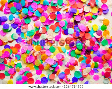 Bright paper confetti. Festive background. Universal template for cards, greetings. Macro photo with natural light.