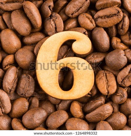 6, Number on wood- background of coffee beans. Coffea