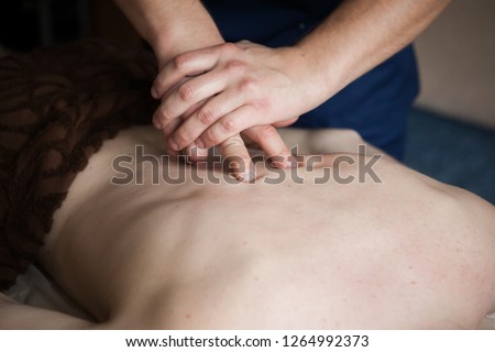 a man doing a traditional manual healing  massage