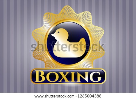  Gold emblem or badge with rubber duck icon and Boxing text inside