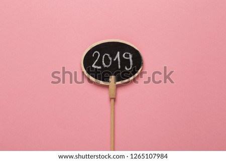 2019 Happy New Year, small blackboard sign with chalk writing. New Year resolution and plans