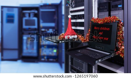 " Merry Christmas and happy new year " on monitor display in server room data center