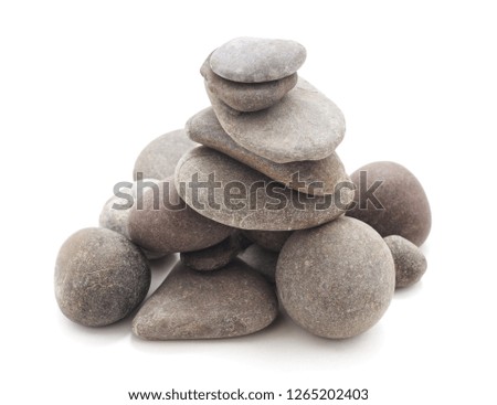 Pyramid of stones isolated on a white background.