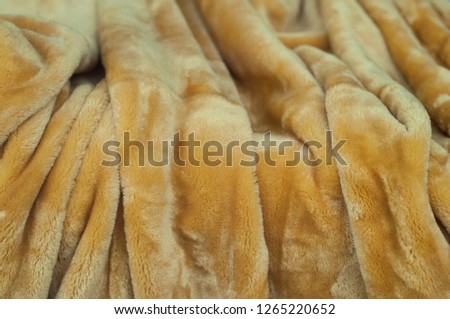closeup of beige blanket texture 