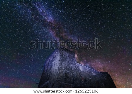 The fiery galaxy Milky way in the night sky with millions of stars over the White Elephant Observatory, which is in the Ukrainian Carpathian Mountains