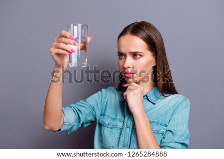 Close up portrait of not sure in quality of water she her woman girl wearing casual jeans shirt outfit clothes isolated on grey background Royalty-Free Stock Photo #1265284888