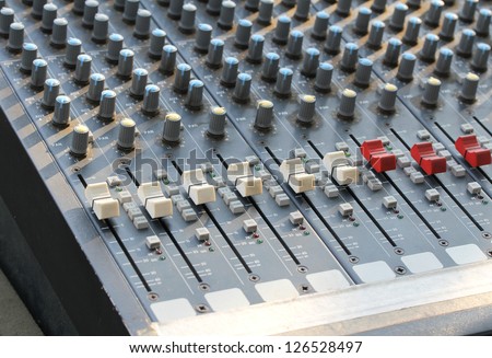 Closeup image of sound mixing board for music consert