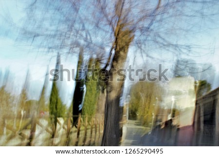 gardens in Autumn, Tribute to Monet, impressionist photograph of the Park of the Roman circus, Toledo, Spain,  photographic sweeps at low shutter speed, feeling of movement, of life,