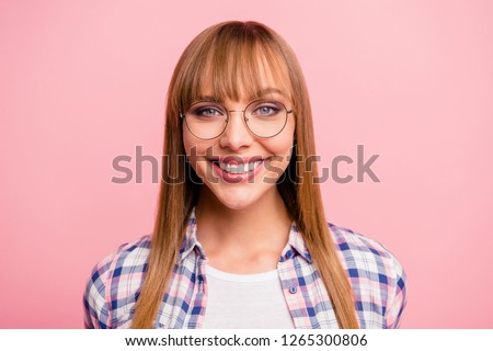 Close-up portrait of nice cute lovely winsome content cheerful cheery attractive straight-haired girl in checked shirt isolated over pink pastel background