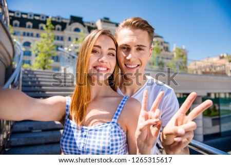 Free time style stylish millennials life concept. Close up photo portrait of two people glad excited romantic sweet tender with teeth teen teenager guy take make shoot picture use stick v-sign