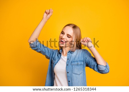 Portrait of nice cute attractive lovely sweet adorable cheerful straight-haired girl raising hands up party isolated over bright vivid shine yellow background