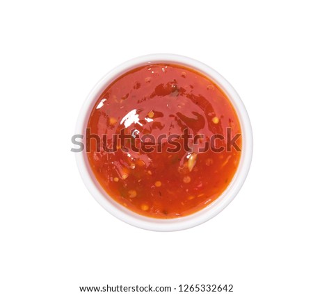 Sweet chili sauce   in ceramic bowl isolated  on a white background.Top view Royalty-Free Stock Photo #1265332642