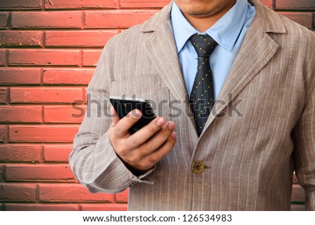 Businessman working with mobile phone