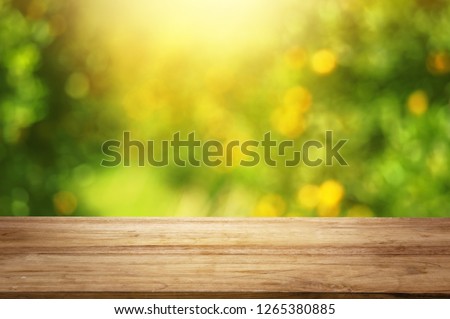 Orange fruit trees background design with wood table top 
