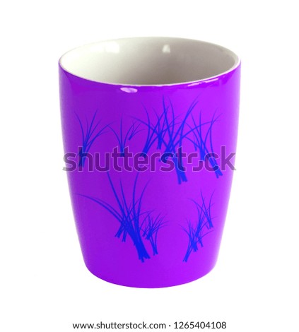 Empty violet porcelain or ceramic cup with floral pattern isolated on white background