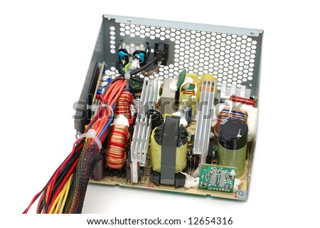 Inside of a computer power supply over white background