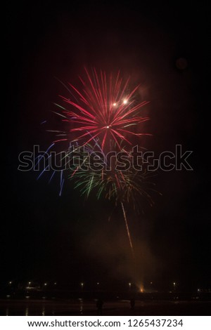 Fireworks explode over Newport Pier in Newport Beach, CA