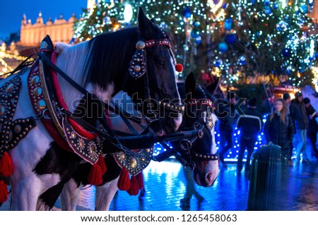 Horses on the background of Christmas tree