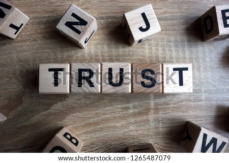 Trust word from wooden blocks on desk
