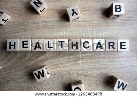 Healthcare word from wooden blocks on desk