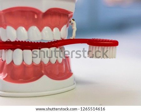 Small assistants in the dental clinic. Men treat teeth, brush teeth, repair different equipment. Bright screen saver for a dental clinic.