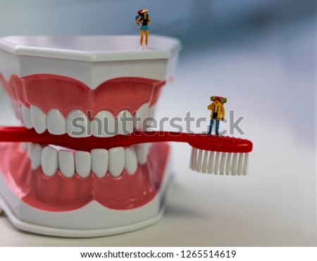 Small assistants in the dental clinic. Men treat teeth, brush teeth, repair different equipment. Bright screen saver for a dental clinic.
