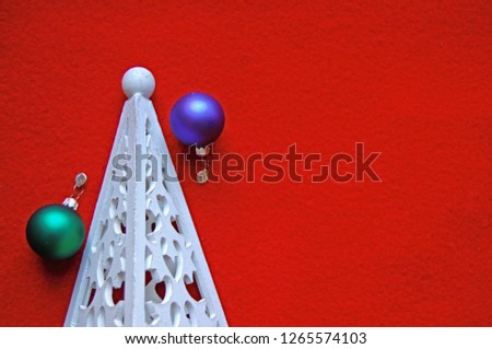Top View of White Christmas Tree Holiday Decoration composition, copy space with red background