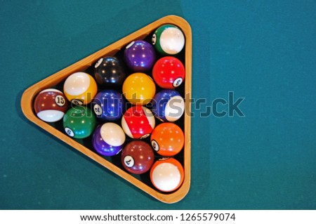 Billiards sport. Recreational pool table balls in triangle on felt background, copy space, overhead top view Royalty-Free Stock Photo #1265579074