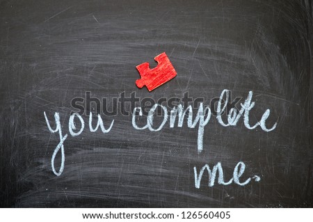 Happy valentine, inscription by hand chalk "you complete me."