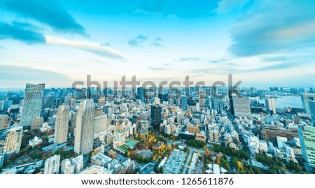 Asia Business concept for real estate and corporate construction - panoramic urban city skyline aerial night view under blue sky and neon light in Tokyo, Japan