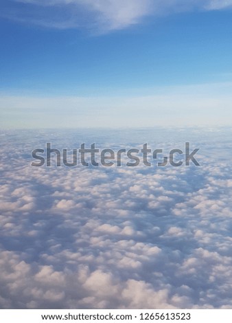 Sky and clouds background, view from airplane's window.