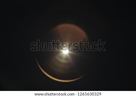 solar eclipse on black Royalty-Free Stock Photo #1265630329